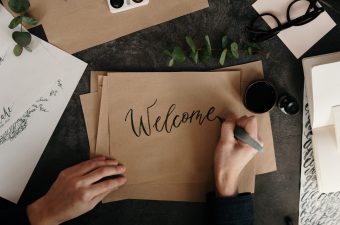 person-writing-on-brown-paper-3826678