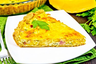 quiche-with-pumpkin-and-bacon-in-plate-on-towel